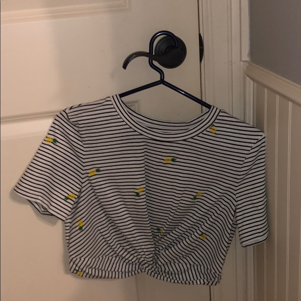 Wild honey pineapple top with cross in the front
